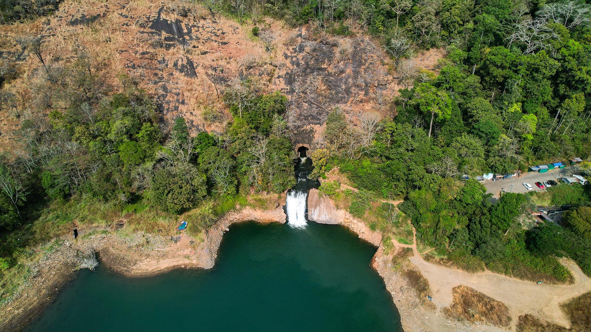 Anjuruli, Idukki: Tunnel Outlet, Waterfall and Reservoir Edge Anjuruli, Idukki: Tunnel Outlet, Waterfall and Reservoir Edge