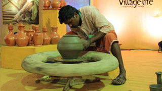 Chami from Wayanad demonstrating pottery making at ongoing Kerala Travel Mart 2016 at Kochi