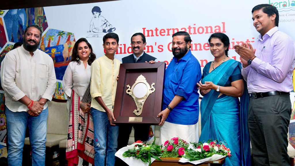 Parth Joshi, receiving first prize from Mr. Kadamapally Surendran, Minister for Tourism