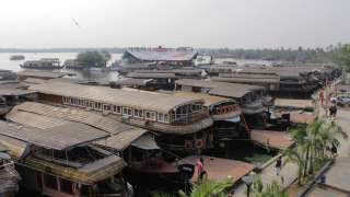 Houseboats lined-up in backwaters of Kerala
