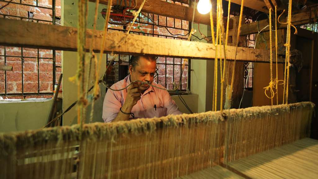 A weaver at Azhikode Handloom Village