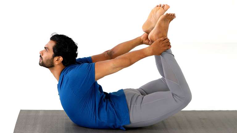 Flexible woman practicing yoga asana on mat · Free Stock Photo